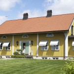 Vindusmarkise - gult hus